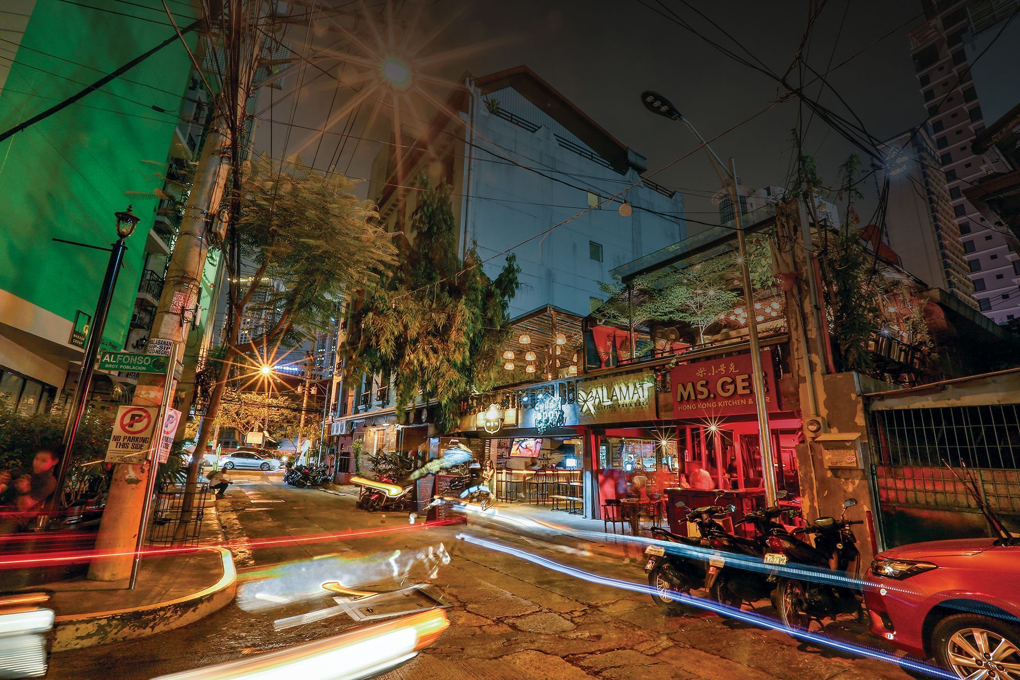 Ms. Gee's facade can be seen in Poblacion at night  | Photo: Tatler Philippines