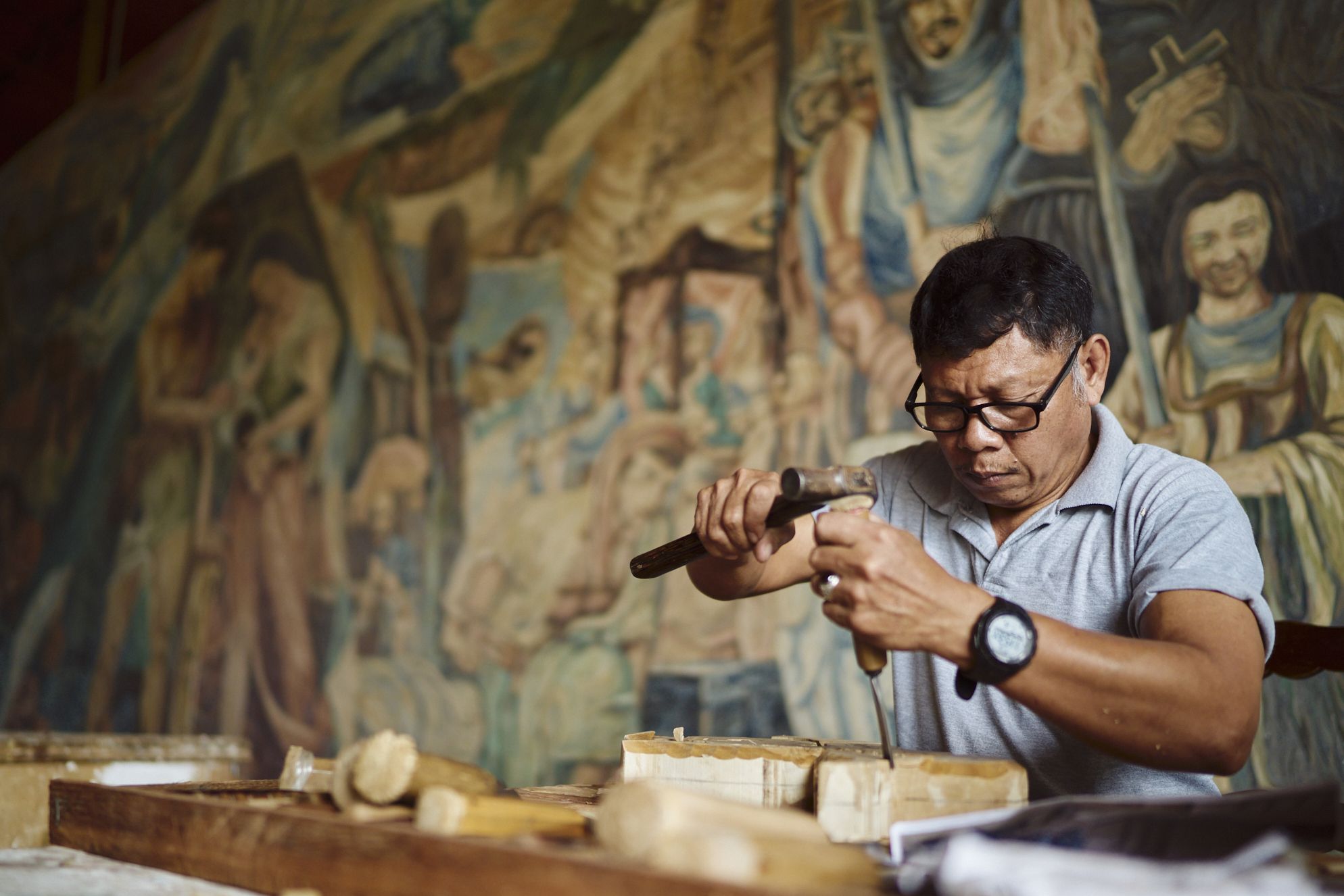 53-year-old Arnold Flores has been working as a sculptor in Las Casas Filipinas de Acuzar for four years, creating intricate hand-carved wood and styro pieces