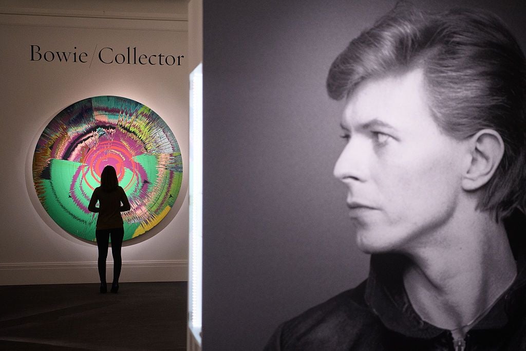 "Beautiful, Hallo, Space-Boy Painting" by Damien Hurst with David Bowie, part of the ”Bowie/Collector" auction at Sotheby's in November 2016 (Photo by Leon Neal/Getty Images)